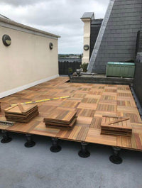 Close up of solid Kempas hardwood deck tile slats
