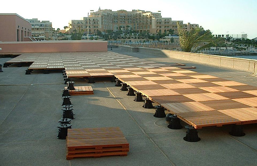Interlocking Kempas wood deck tiles installed on an outdoor deck